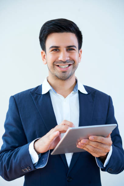 istock Happy businessman with digital tablet 1138374659