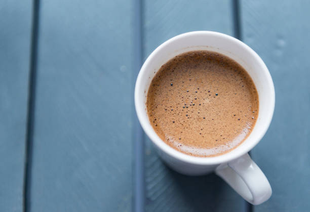 istock white mug with black coffee on grey background, top view, hot drink 1138375566