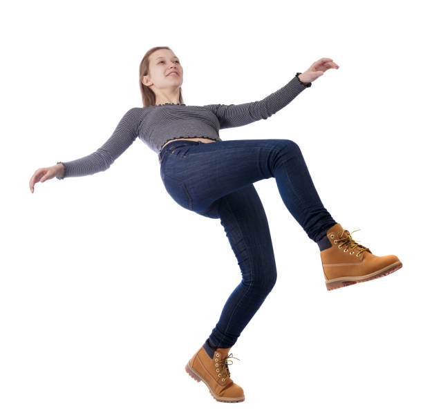 Balancing young woman. Balancing young woman. or dodge falling woman. Rear view people collection. backside view of person. Isolated over white background. Happy girl falls back. falling behind stock pictures, royalty-free photos & images
