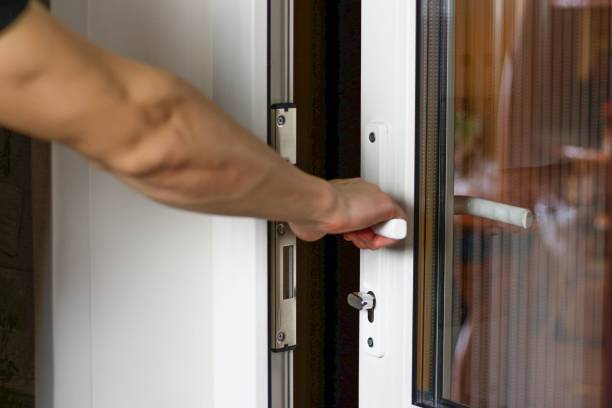 istock A man's hand opens a white plastic door. Close up 1138376748