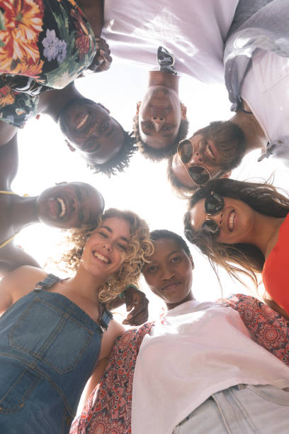 istock Group of friends forming huddle 1138376849
