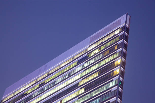 istock top of a skyscraper at night with light in windows 1138377787