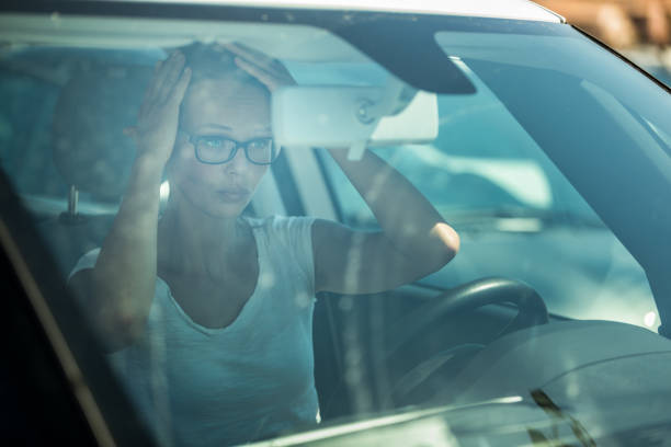 istock Pretty, young woman  driving her car 1138378099