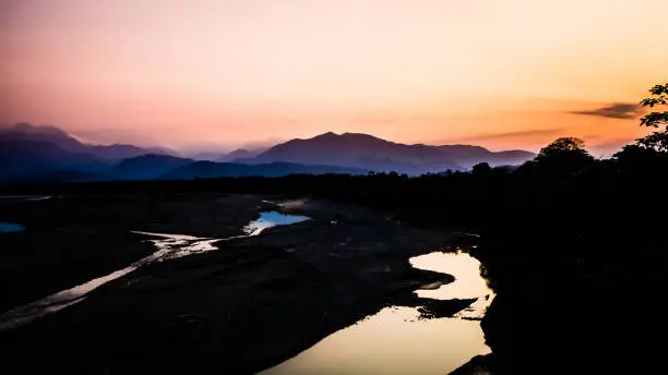 Photo of Landscape during the sunset in Villa Tunari, Bolivia. High contrast pic with the river and the mountains in the back