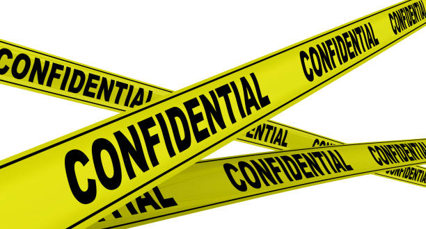 istock Confidential. Labeled yellow warning tapes 1138380793