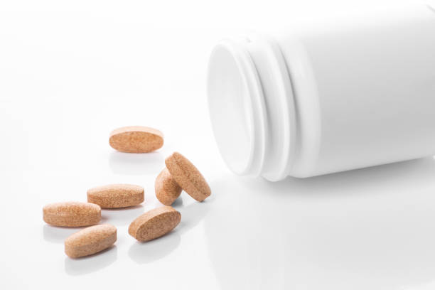 istock Medicine bottle with pills isolated 1138381496
