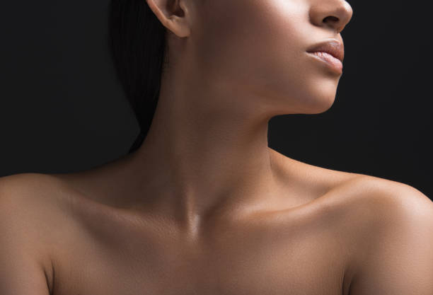 Female person having perfect skin covering Close up of woman ideal naked pelt. Isolated on black background neck photos stock pictures, royalty-free photos & images