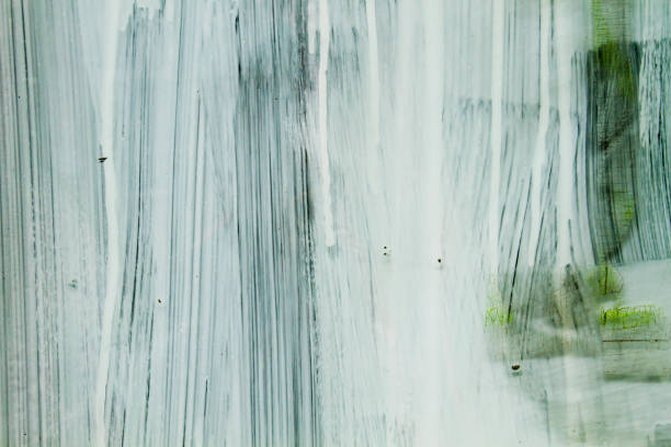 White paint on a blinded window glass, abstract background or texture