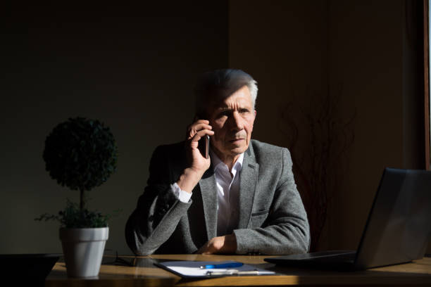 istock Senior businessman making a phone call 1138382469