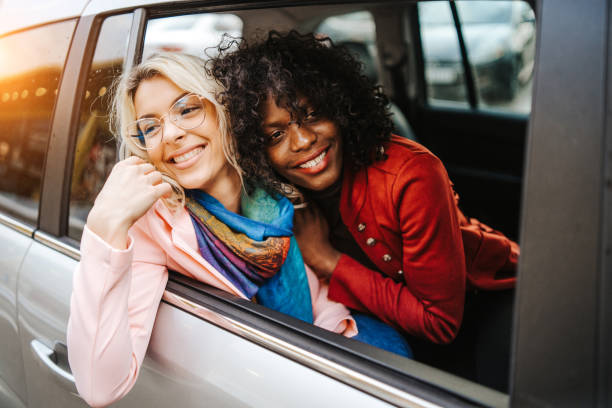 istock Happy female friends on road trip 1138382521