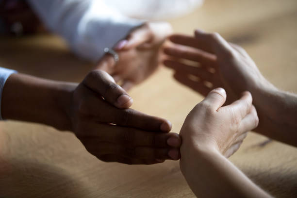 istock Close up business people join hands forming circle, show unity 1138382767
