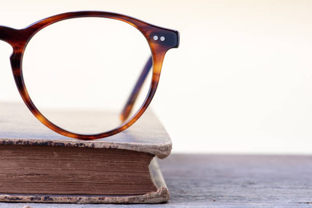 istock Vintage glasses and old book 1138384498
