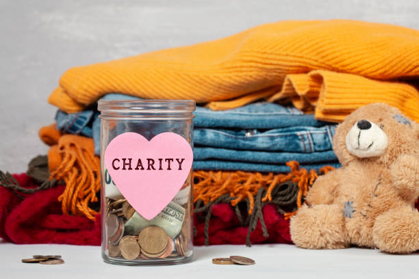 istock Coins, banknotes in money jar and box with donations 1138385319