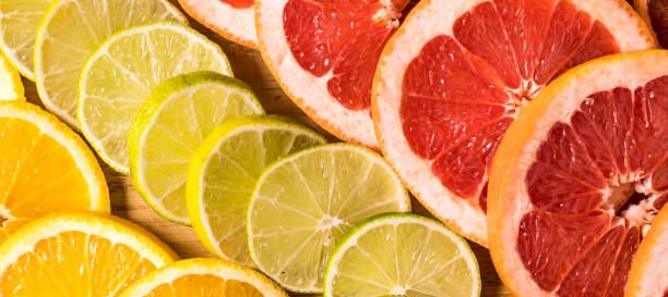 istock Flat lay slices of different raw fresh citrus fruit. 1138385358