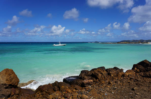 istock Caribbean sea with small white boat Grenada 1138386287