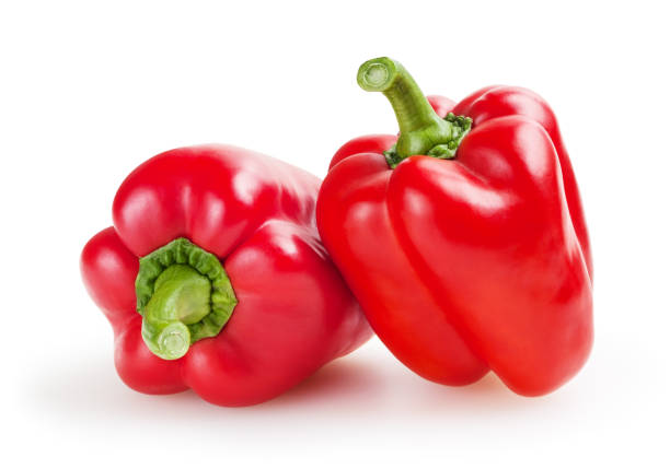 Red bell peppers isolated on white background with clipping path Red bell peppers isolated on white background with clipping path red bell pepper stock pictures, royalty-free photos & images