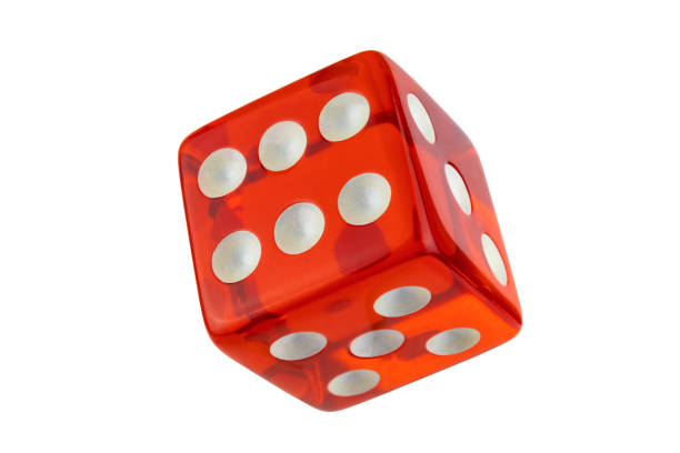Red glass dice closeup isolated on white without shadow.
