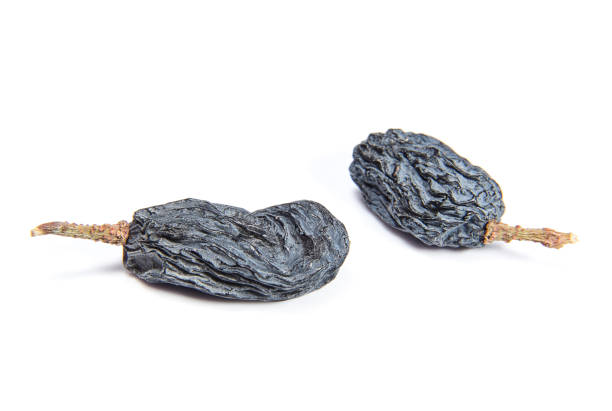 istock Berries of dark raisins closeup isilated on a white background 1138389622