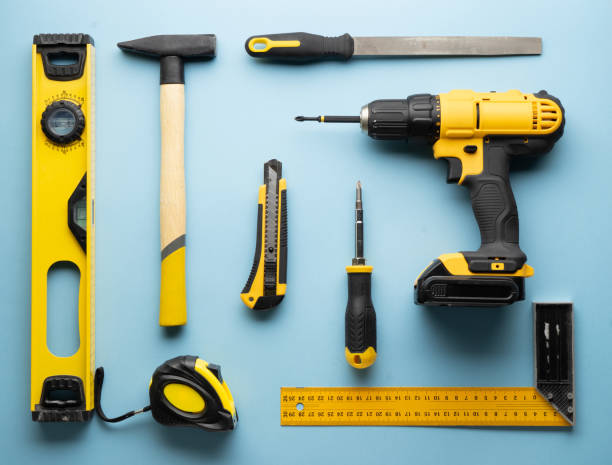 istock Creative provocation: a flat layout of yellow hand tools on a blue background. 1138391007