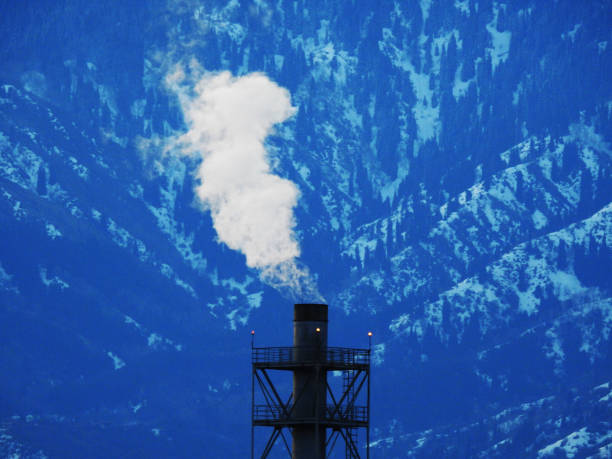 GREAT WHITE SMOKE ON THE BACKGROUND OF THE BLUE MOUNTAINS stock photo