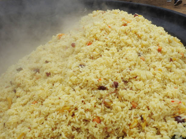 pilaf. Eastern, Uzbek national dishes with rice. meat, peas stock photo