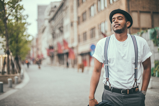 One man, Handsome young gentleman standing on the street downtown in city.