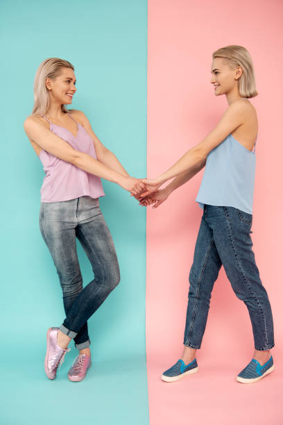 istock Happy young ladies being friendly 1138393475