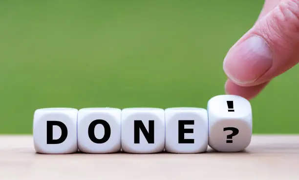 Hand turns a dice and changes the expression "Done?" to "Done!".