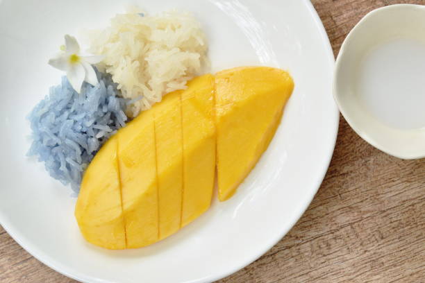 istock ripen mango with white and purple sticky rice dressing coconut milk 1138394238