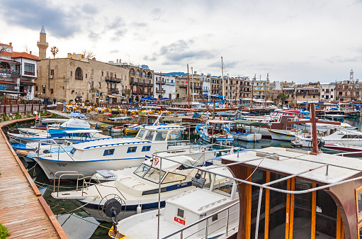 Kyrenia, Cyprus - January 19, 2015: Winter view of Kyrenia old harbour in Northern Cyprus. Kyrenia (Turkish: Girne) is a city on the northern coast of Cyprus, noted for its historic harbour and castle