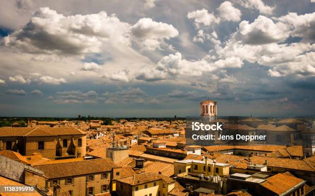 View Over The Red Roofs Of Ferrara Italy During An Approaching Thunderstorm Stock Photo - Download Image Now