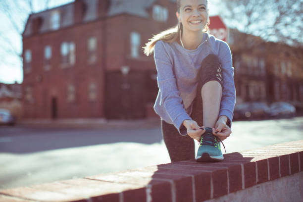 istock Woman Tying Shoelaces 1138395984