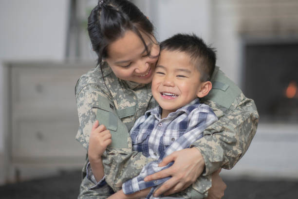 istock Military Mom Hugging Her Son 1138396640