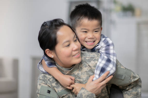 istock Military Mom Hugging Her Son 1138396644