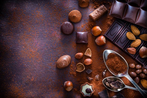 istock Chocolate assortment and cocoa powder with copy space shot from above 1138398399