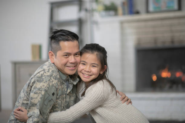 istock Military Dad Hugging His Young Daughter 1138398678