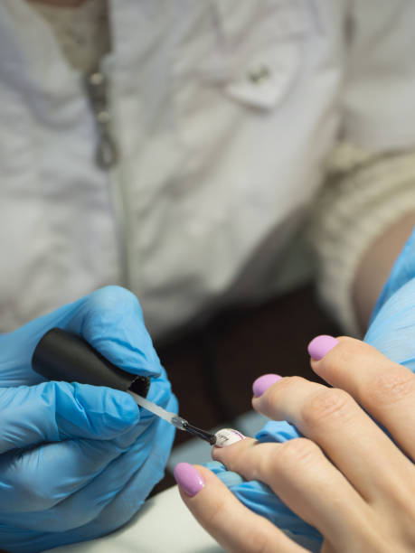 istock Manicure procedures. Nail uv-varnish, close-up. 1138400223