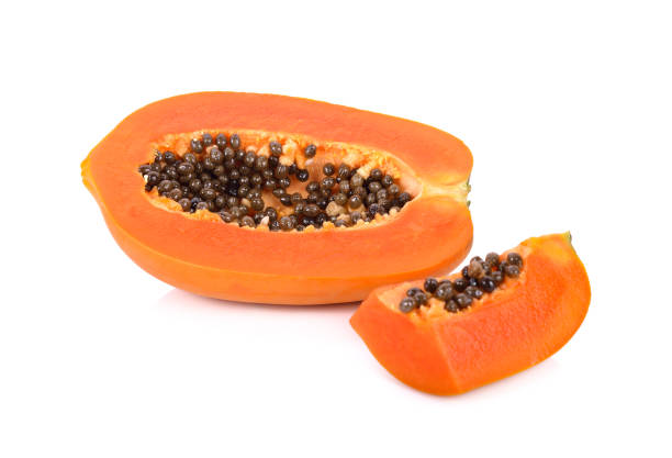 istock haft and portion cut ripe papaya with seeds on white background 1138402594