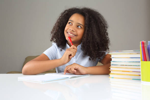 istock schoolgirl is thinking about school homework doing homework 1138403459