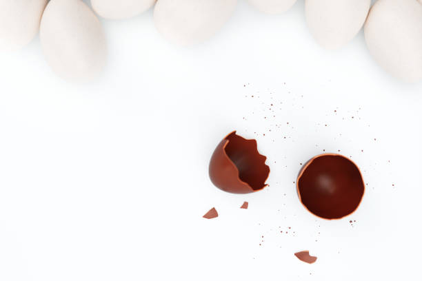 istock One chocolate egg broken on two pieces. Chocolate egg around white eggs, concept individuality, exclusivity. Sweet yummy chocolate egg. Symbol of holiday, Easter. 3D illustration 1138406702