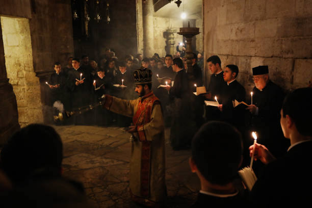 Armenian procession at the Holy Sepulchre church Jerusalem old city Jerusalem, Israel - 03 24 2018: Armenian procession at the Holy Sepulchre church Jerusalem old city east jerusalem stock pictures, royalty-free photos & images
