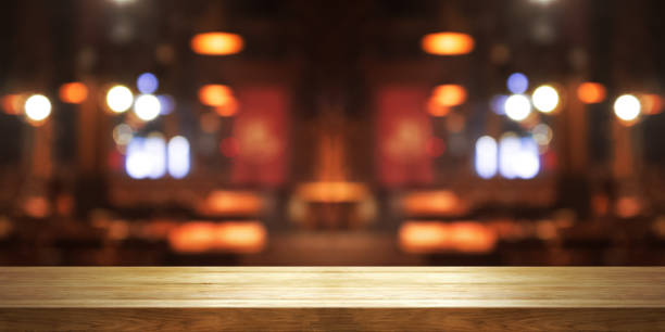 istock Empty wooden table top with blur coffee shop or restaurant interior background, 1138411284