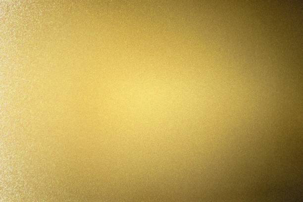 istock Abstract texture background, reflection brushed gold metallic wall in dark room 1138412214