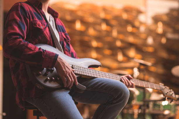 istock Young musician with a guitar 1138412232