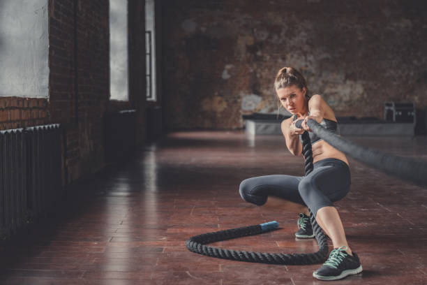 istock Young athletic girl with a rope 1138413242