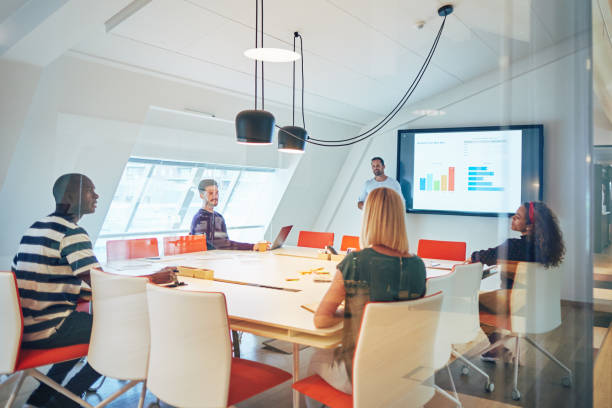 istock Diverse group of colleagues talking together during an office presentation 1138414110