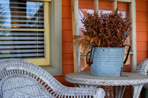 istock Dried Foliage ina metal bucket on a wicker table 1138416052