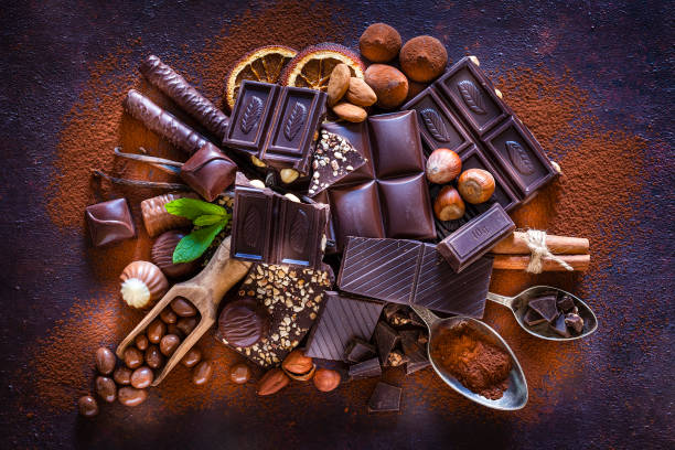 istock Chocolate assortment on cocoa powder shot from above 1138416137