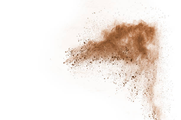 istock Brown color powder explosion on white background. Colored cloud. Colorful dust explode. Paint Holi. 1138417798