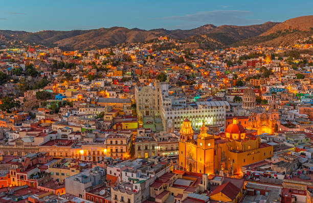 Blue Hour Cityscape of Guanajuato, Mexico Cityscape of Guanajuato city during the blue hour with the famous orange Basilica of Our Lady of Guanajuato, Mexico. queretaro city stock pictures, royalty-free photos & images